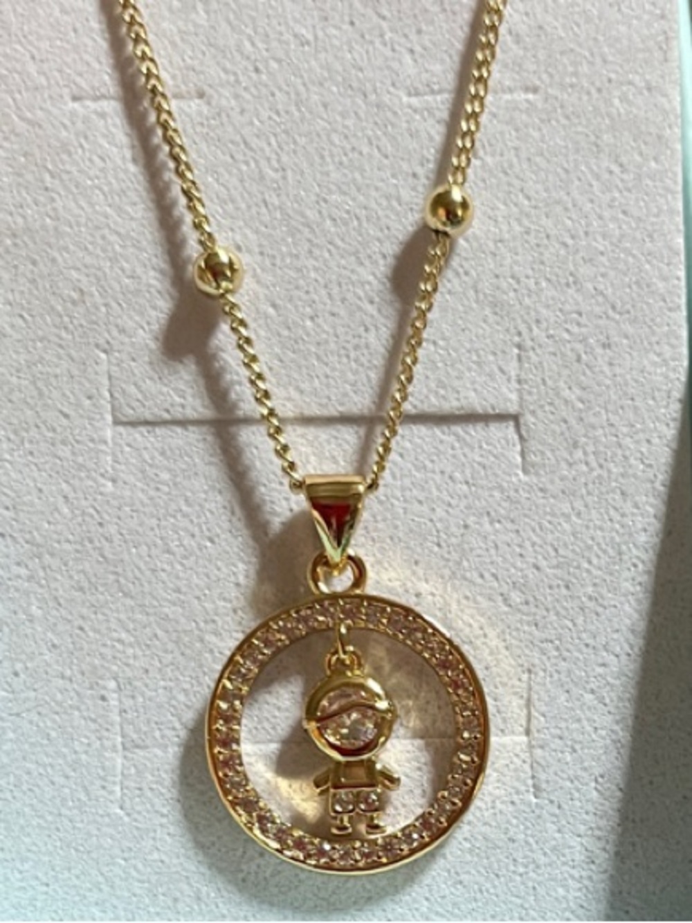 Pretty Bird Gold Circular Pendant Necklace with Crystal Accents and Child Charm
